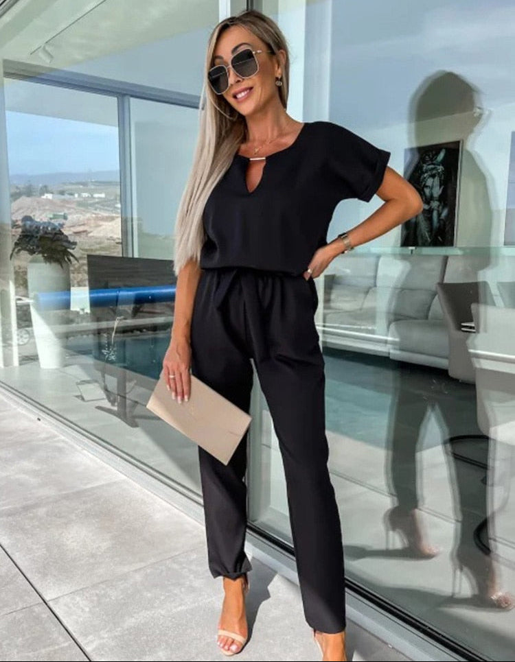 Dames jumpsuit met V-hals ceintuur en korte mouwen