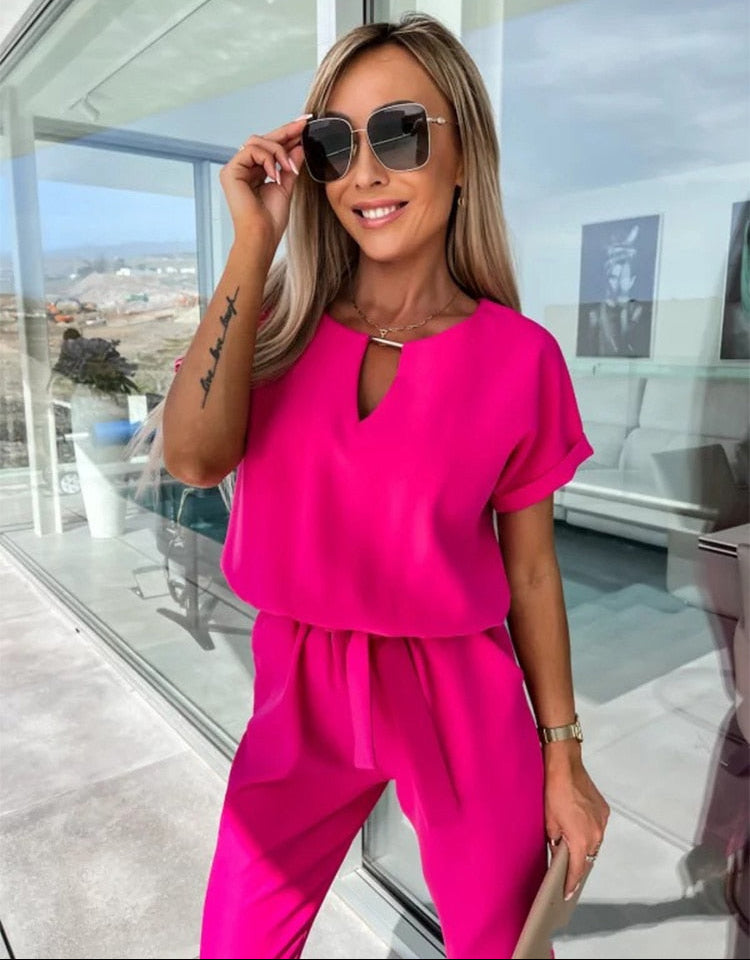 Dames jumpsuit met V-hals ceintuur en korte mouwen